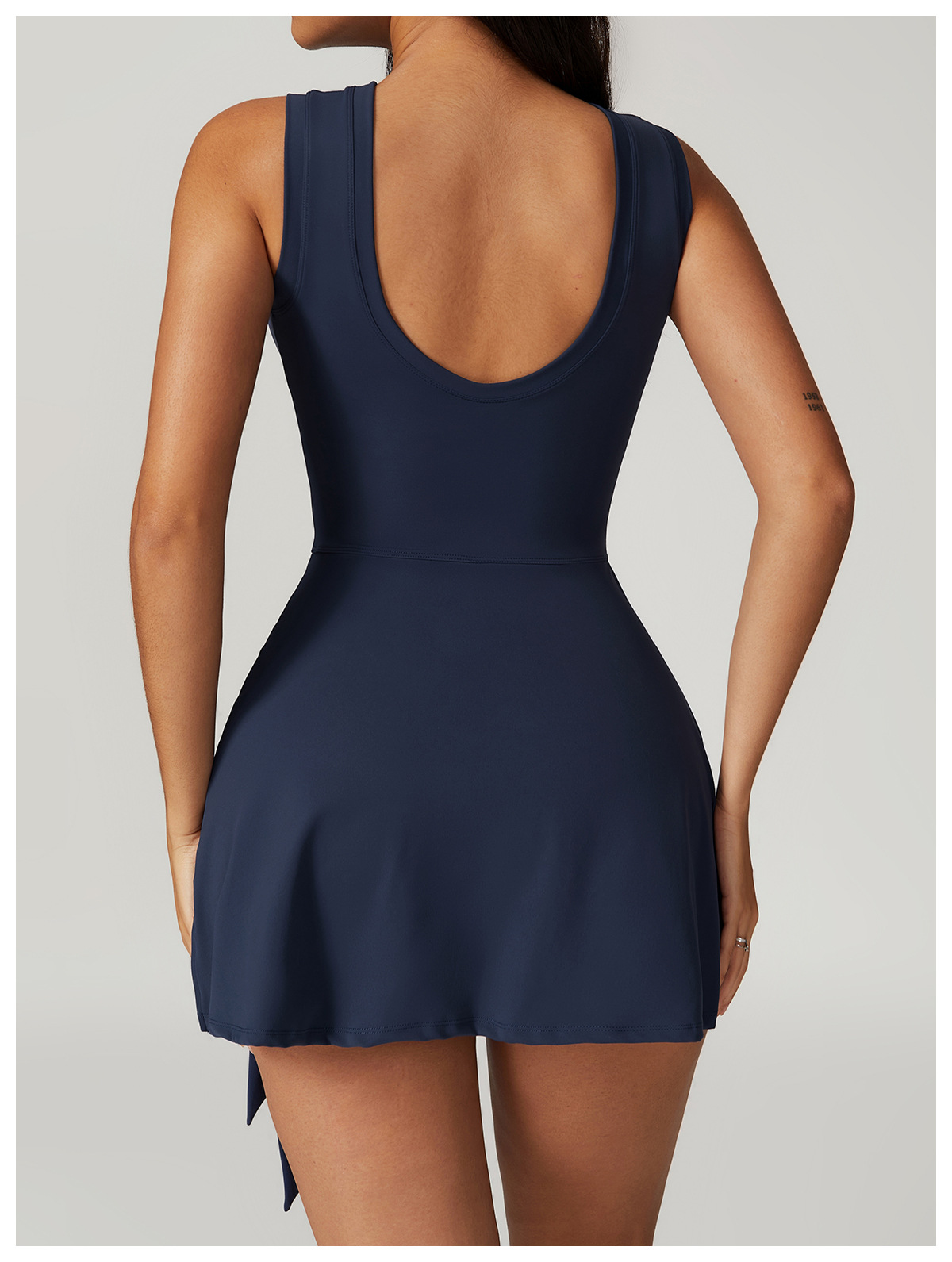 Backless athletic skort one-piece with waist tie