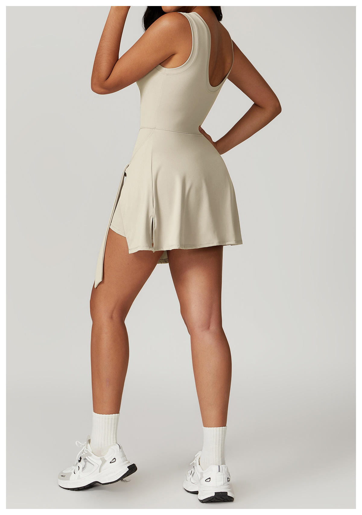 Backless athletic skort one-piece with waist tie